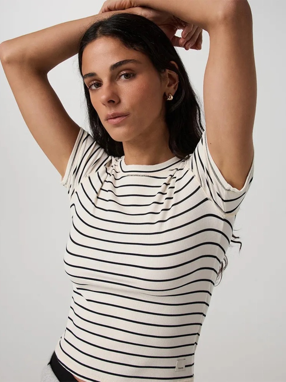 Vuori pose Ivory and Black Striped Short-Sleeve Crew Tee